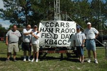 The gang gathers around the club sign: L-R: Dave (K4EHI), Joe (AA4BZ), Kenneth (KI4FMV), Tim (AA4SS), John (WD8LQT)